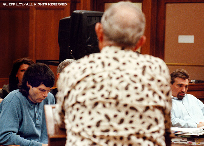John Thomas Parker, left, and Kenneth Wayne Enlow listen as they are addressed by Aud Brown after a jury returned a “guilty” verdict against the two for the beating attack of Brown's wife, Loreta.